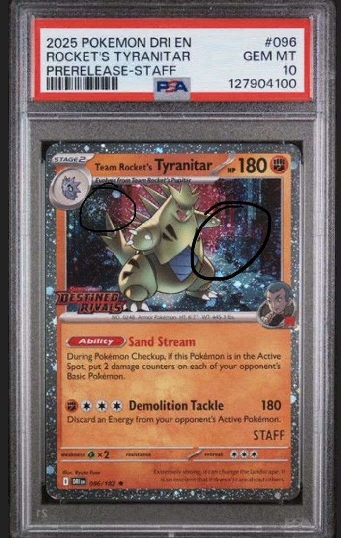 Back of the PSA slab for Team Rocket's Tyranitar, showing cert 127904100
